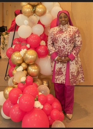 Student Protocol Director, Sister Anthanetta Muhammad wearing a beautiful garment by Queen Aminah. Photo by Norman Muhammad