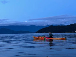 The author kayaking at dusk in the Howe Sound.