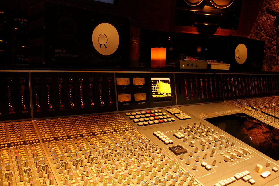 Recording studio control room with a mixing console and studio monitors