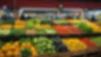 Eye-level view of a market stall displaying fresh fruits and vegetables