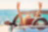 Happy and carefree woman in the car on the beach.jpg