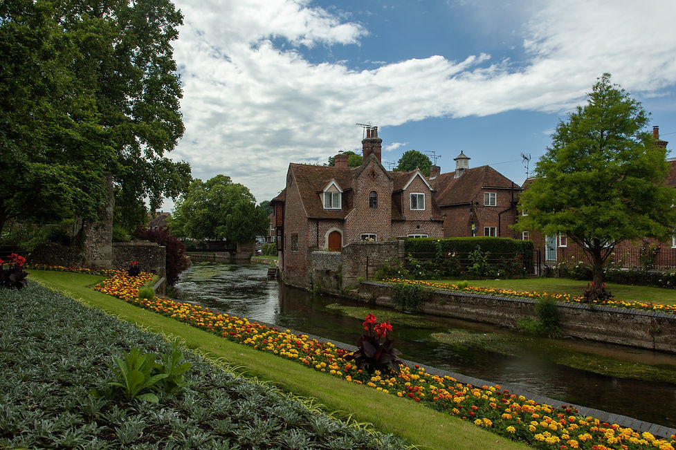 road-surrounded-by-buildings-gardens-after-rain-canterbury-uk.jpg