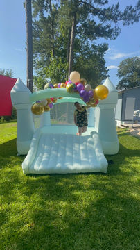 13 x 13 teal bounce house with slide enterance