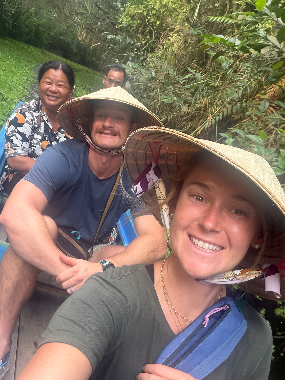 Ms. Ha smiling, sitting behind Nick.