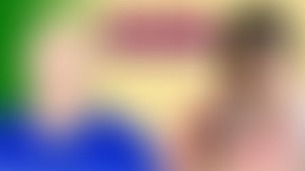 A person blowing into a peak flow meter monitoring her asthma