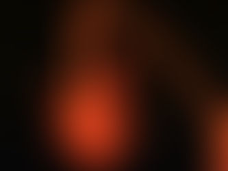Red light therapy in progress. Beam of red light focused on a patient in a darkened room
