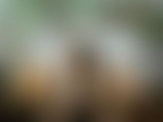 A woman deeply involved in focused deep breathing exercises.