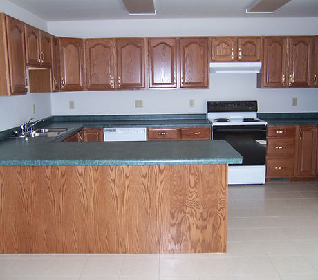 Spacious kitchen with breakfast bar, stove/oven, dishwasher and lots of cabinet space.