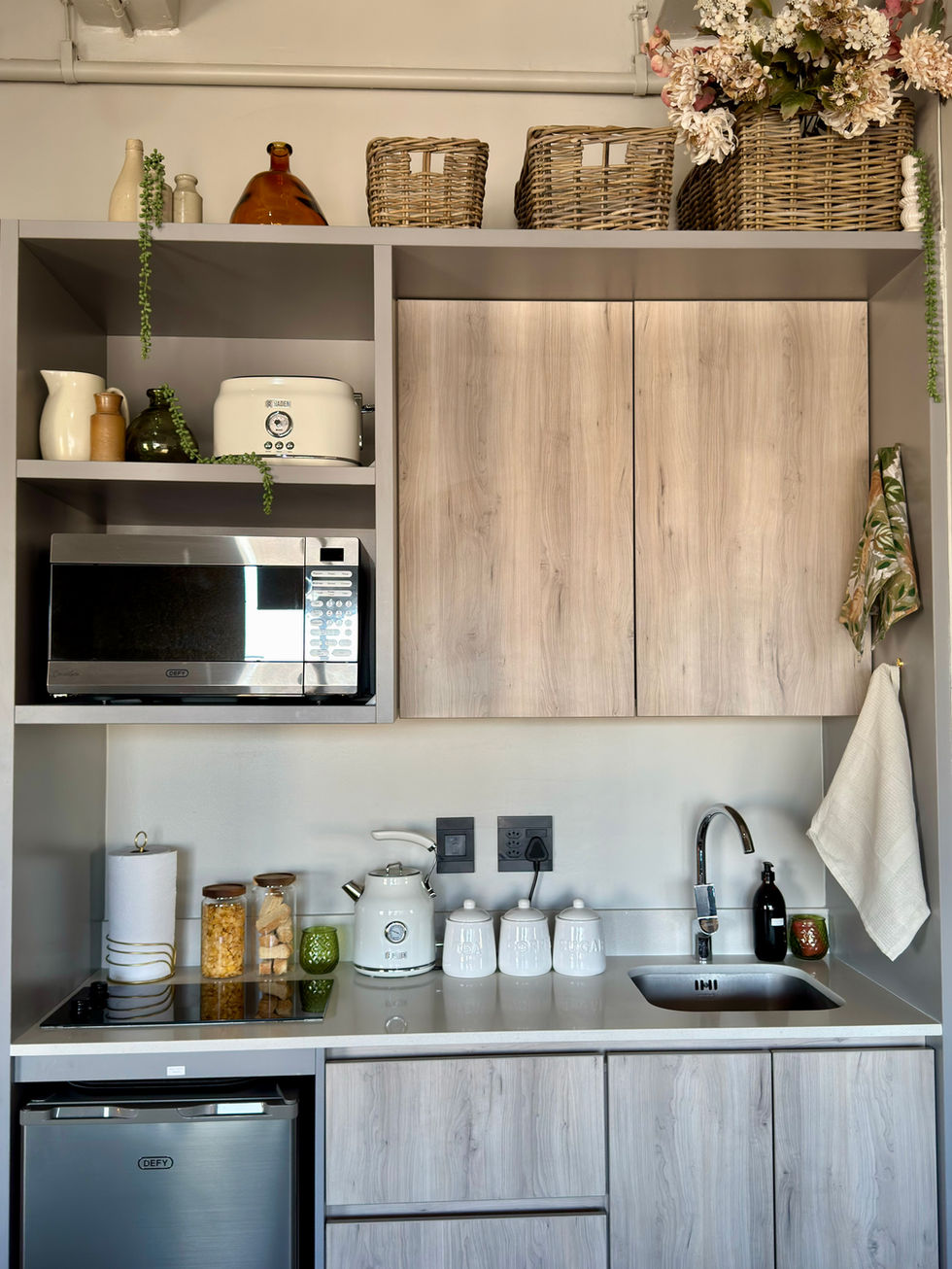 Airbnb kitchen showing rusks, cereal and coffee supplies. Creating a warm and inviting Airbnb atmosphere
