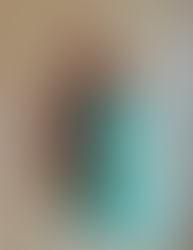 Neil Grant, Sculptor, standing behind one of his busts