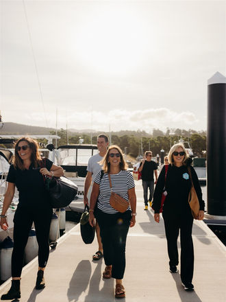 Guests arriving at KUUMA floating sauna at Margate Marina in Hobart.