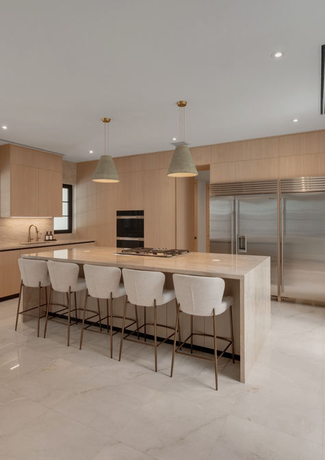 Pedini Moka open kitchen in light oak with marble waterfall island, sage pendants, and arched steel windows to the pool in Coral Gables Miami