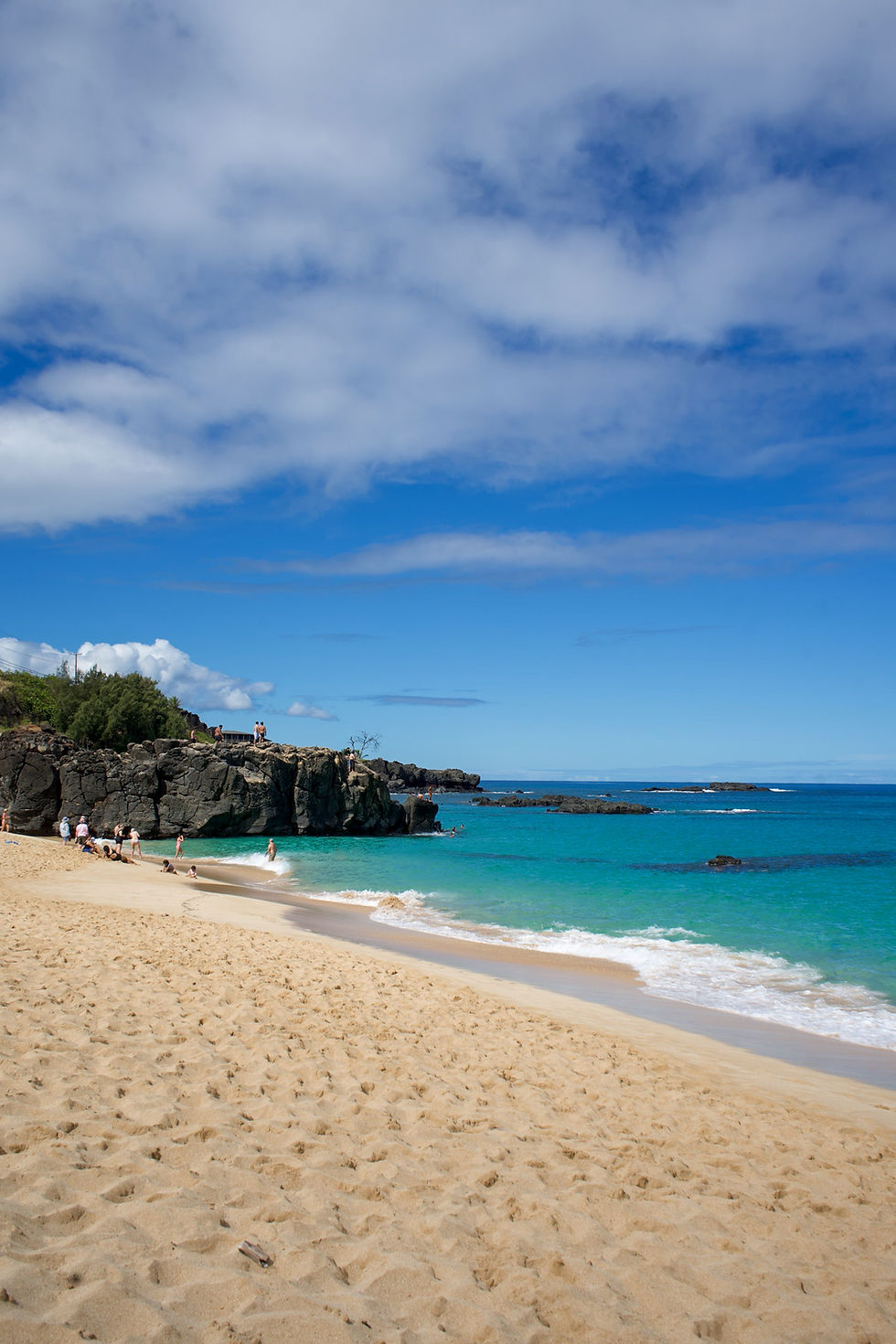 cliff jumping rock at Waimea Bay in North Shore Oahu Hawaii