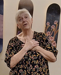 A picture of Kim with her hands over her heart.