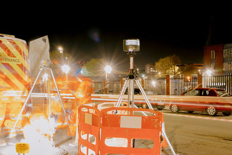 Tripod-mounted Faro Focus laser scanner documenting as-built conditions on high-rise construction project.