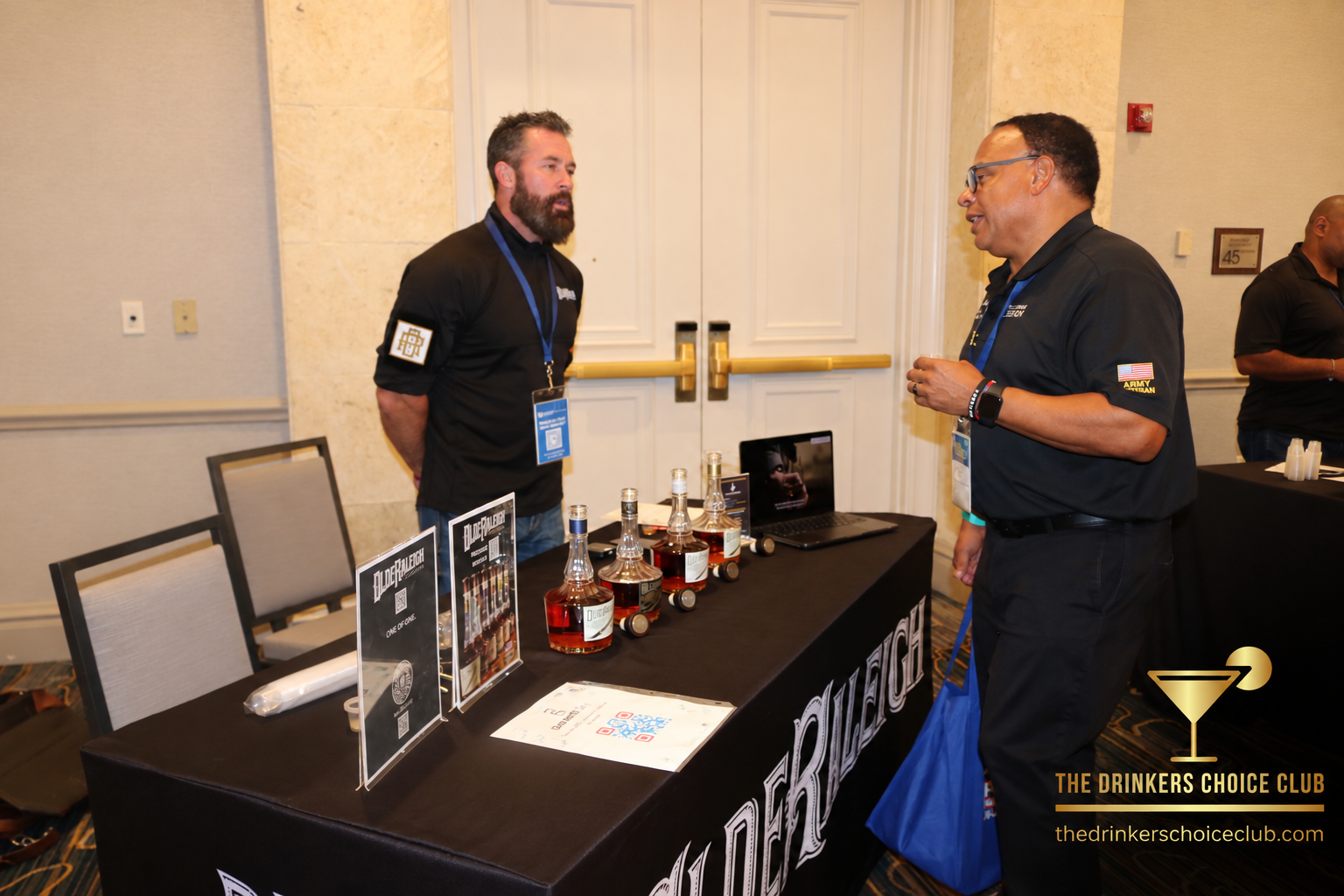 Brandon McCraney of Olde Raleigh Distillery speaking with a guest at C.R.A.F.T. Frontline Tastings in Tampa.