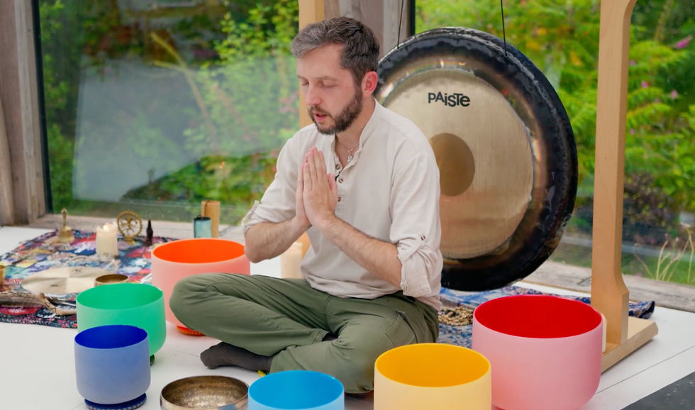 Sound Healer in prayer pose setting the intention for the sound bath.