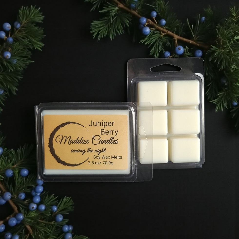 Juniper Berry wax melt package from Maddox Candles among the night.