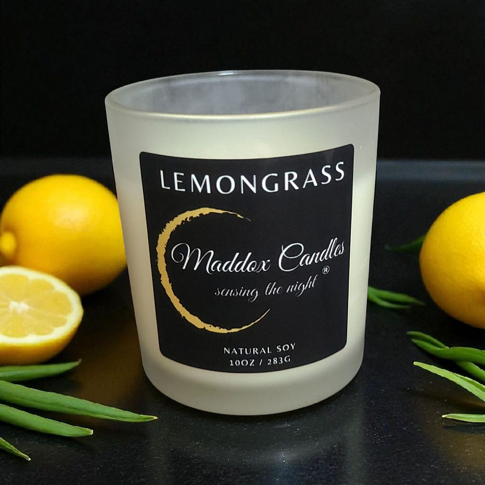 Lemongrass Maddox Candles with lemons and green leaves, creating the night, island life scented candle.