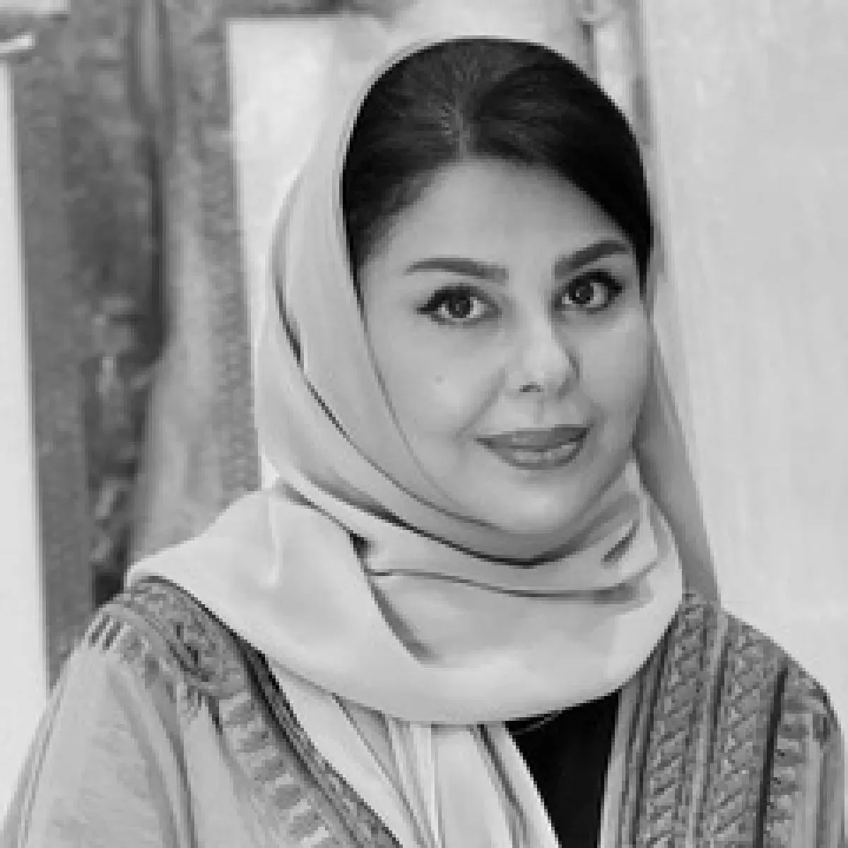 Lulwah Al‑Homoud in her studio with calligraphic abstract work