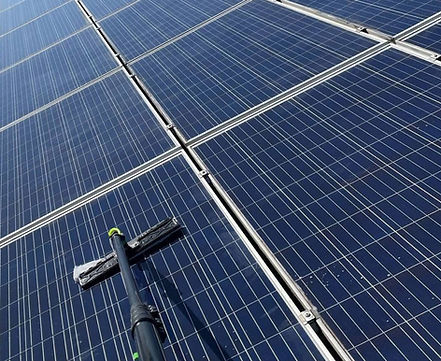 Professional solar farm cleaning in South Wales using eco-friendly deionised water system to maximise energy output