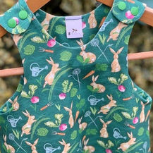 children's clothing with my little gardeners allotment design, showing my surface pattern design with watercolour and printmaking technqiues