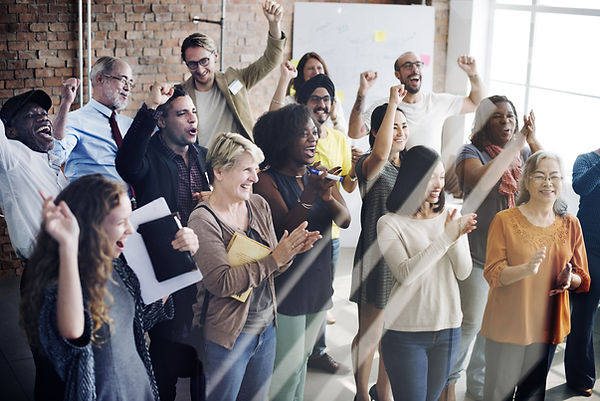 Group of people cheering and clapping