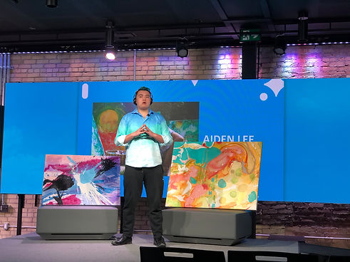 Artist Aiden Lee on a studio stage