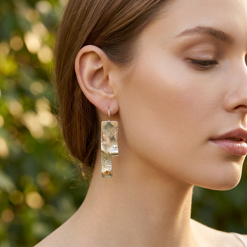 Woman with reticulated curled rectangle earrings