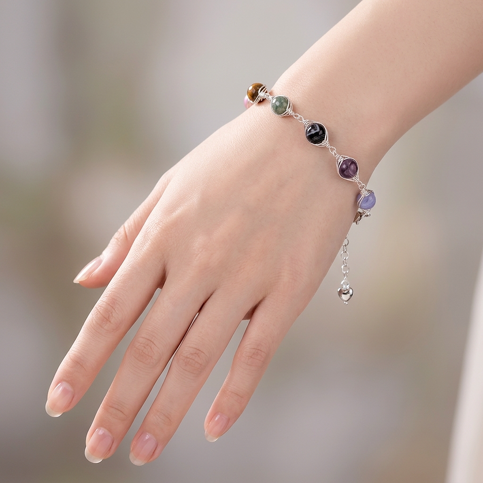 Hand wearing a colorful gemstone bracelet