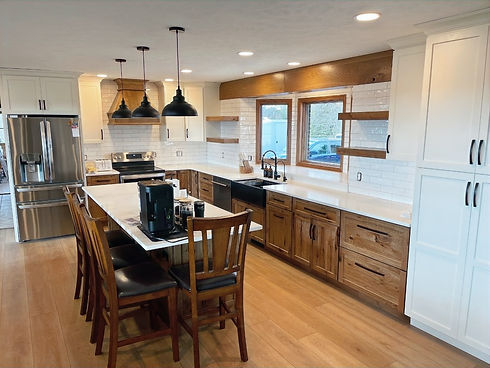 Kitchen - Brown cabinets, subway tile, wood beam - wide shot edited_edited.jpg