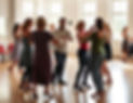 Dance class in a bright room in Austria with people aged 20 - 40 dancing salsa with 1 inst