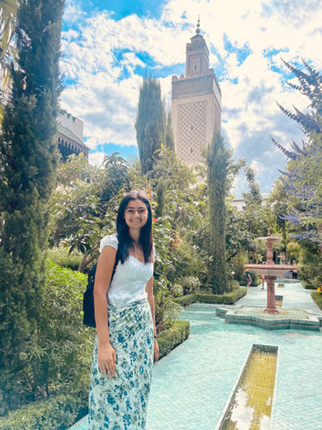 French tutor and student at a Parisian café terrace — combining language learning with local culture