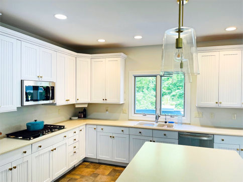 After image of refinished kitchen cabinets. 