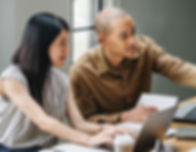 woman and man talking by the desk