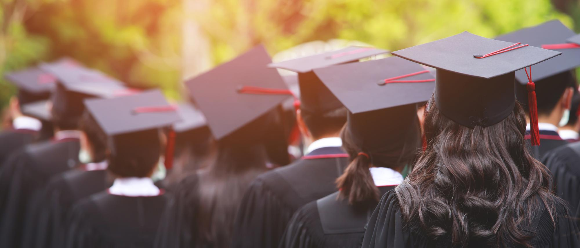 shot-graduation-hats-during-commencement-success-graduates-university-concept-education-co