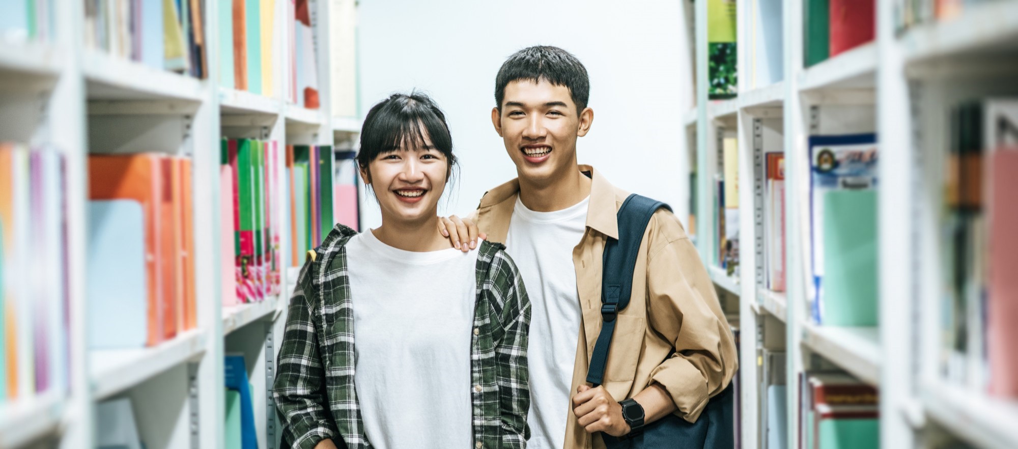 men-women-carrying-backpack-searching-books-library_Edited.jpg