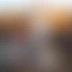 Anna smiling with children at village in Malawi.