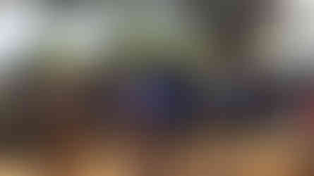 Group of Malawian villagers praying with their hands in the air as RTH Malawi Staff Alfred leads them in prayer.