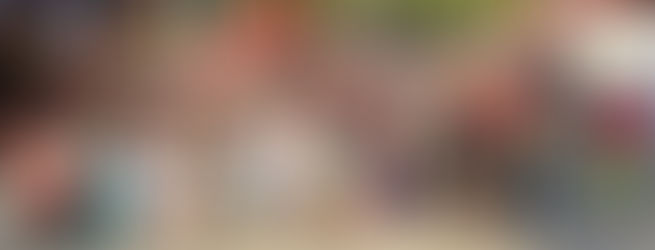 Mission trip team gathered with the children and staff in front of the orphanage.