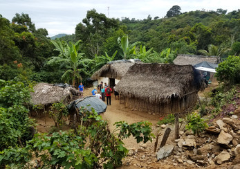 Team standing in a village up in the jungles of Guatemala.