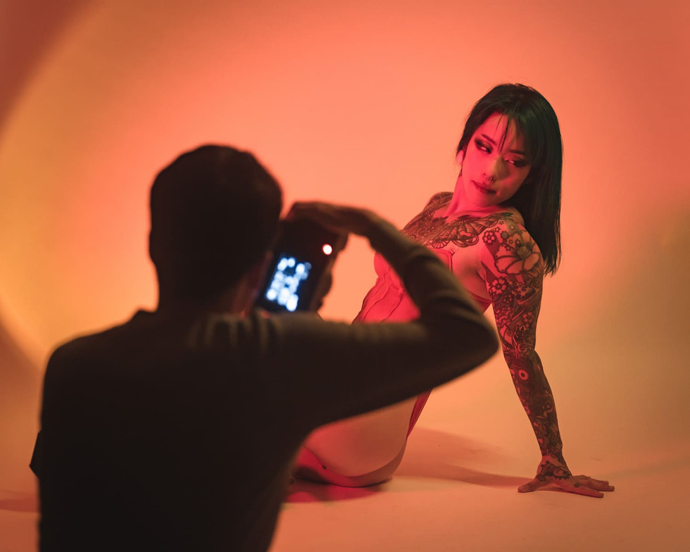 Photographer Denez Demir in action, capturing Model Azumi at Tekumi Studios in Tokyo. The image showcases the creative use of light and shadow