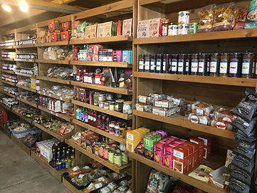 Fresh produce on shelves in farm shop