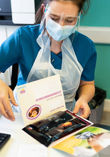 nurse looking over scans