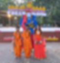Children in traditional attire with a Ravana effigy