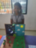 Student presenting a day and night cycle science project