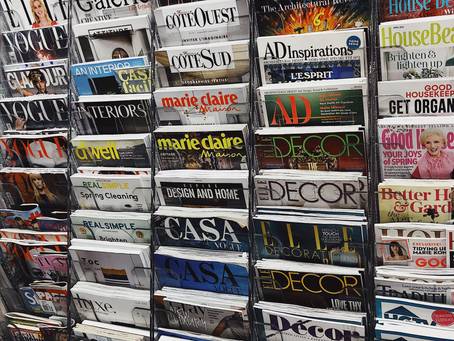 An image of magazines on a newstand