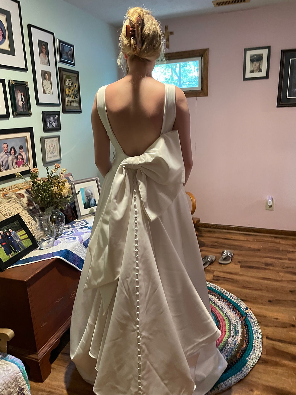 wedding dress with aysemmetrical bow