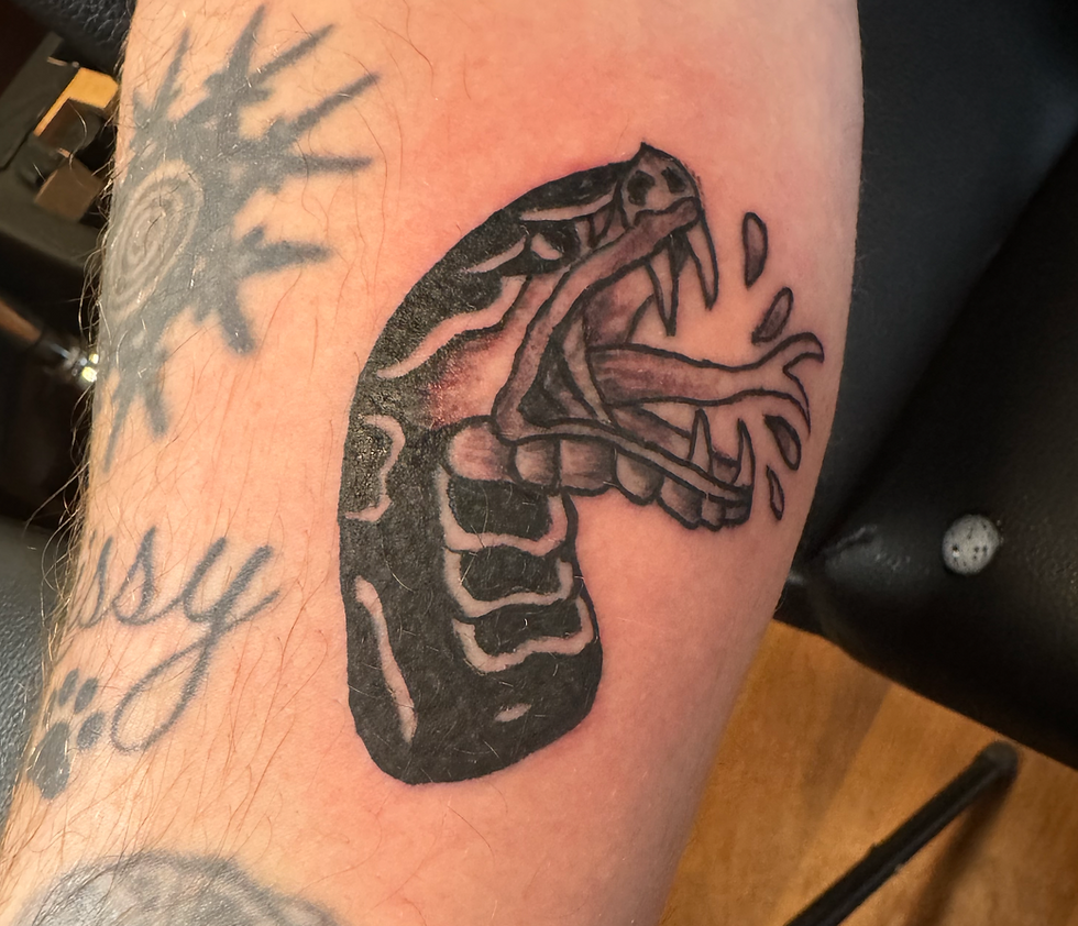 Snake head tattoo