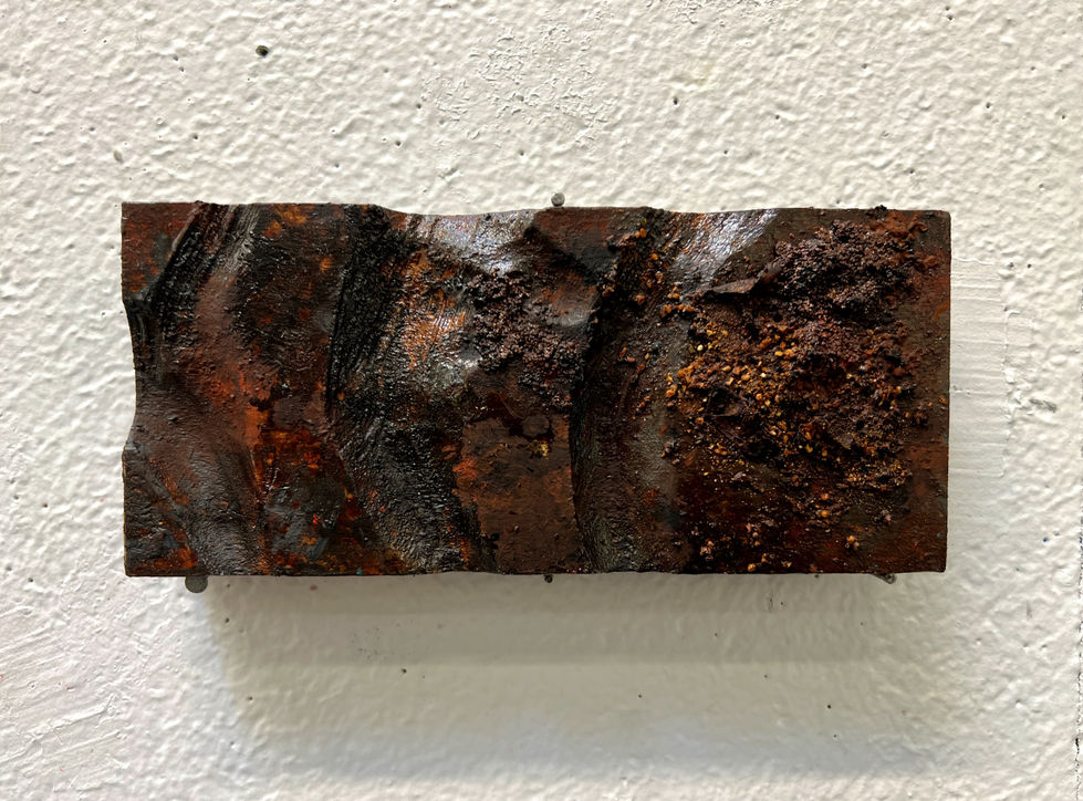 found objects mediums, such as dirt, dirt, and seeds on carved wood piece